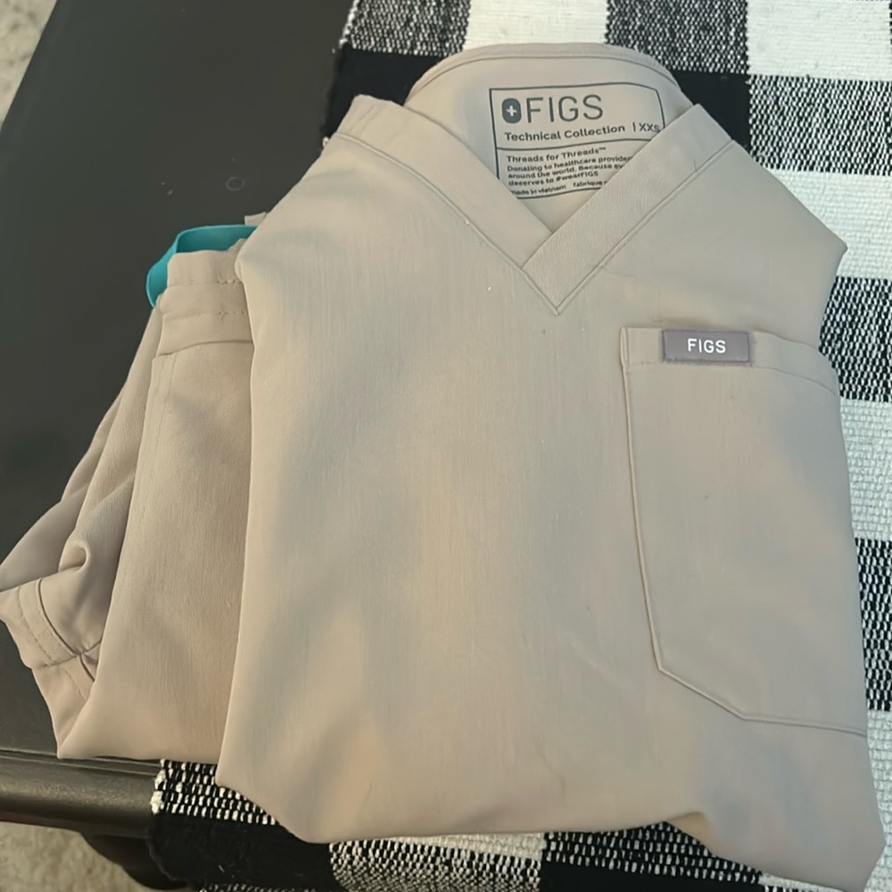 Sand figs scrubs. Pants are straight leg. Both top and bottoms are xxs.